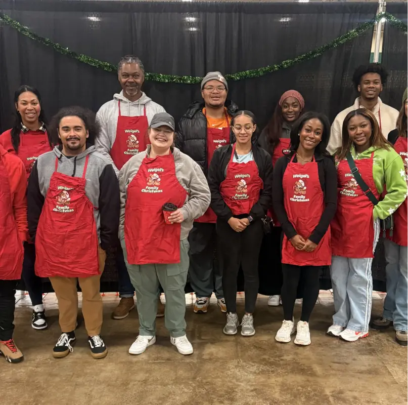 Knoxville Urban League volunteers wearing red aprons.