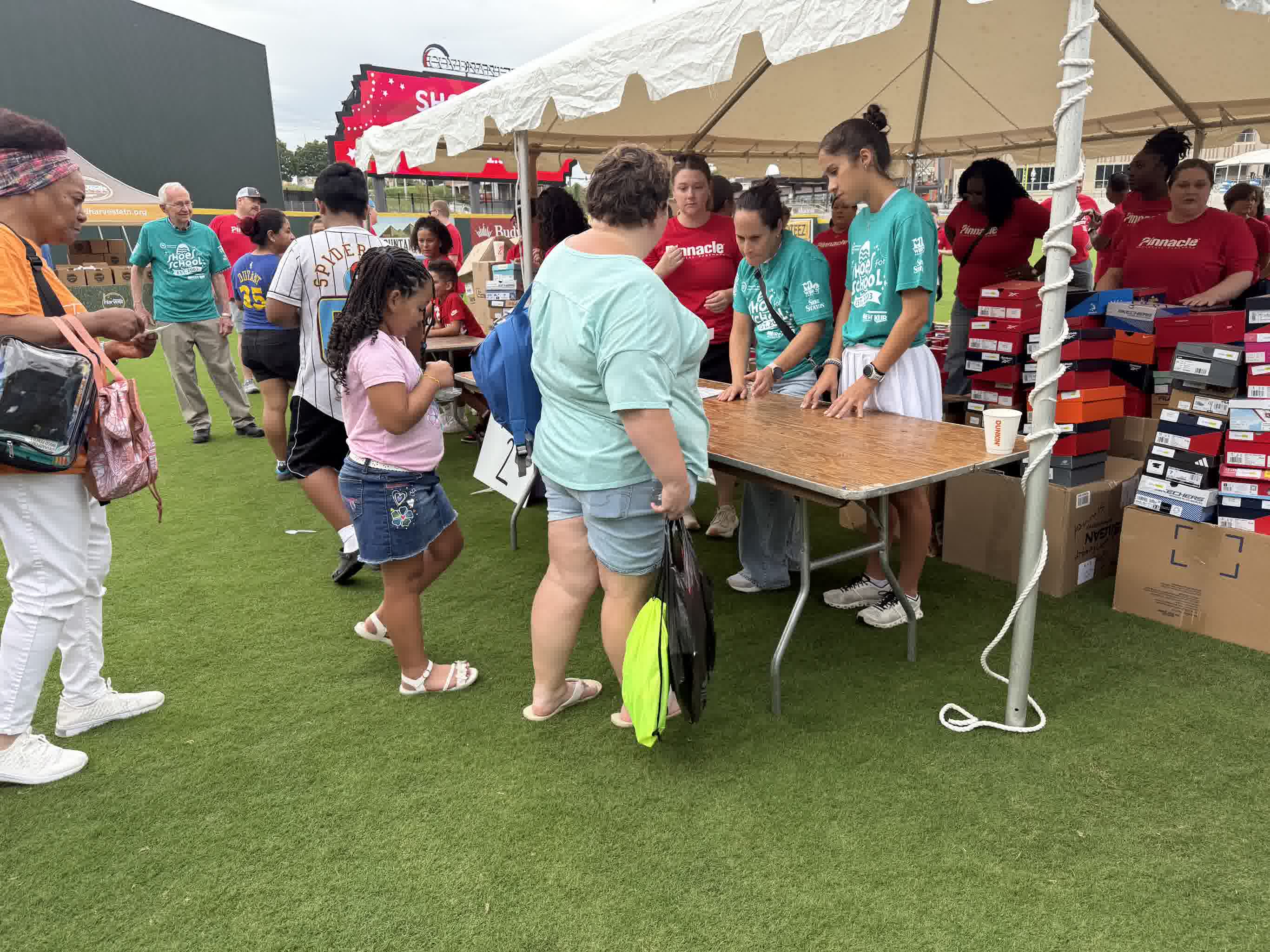 Families and volunteers at a Knoxville Area Urban League community event