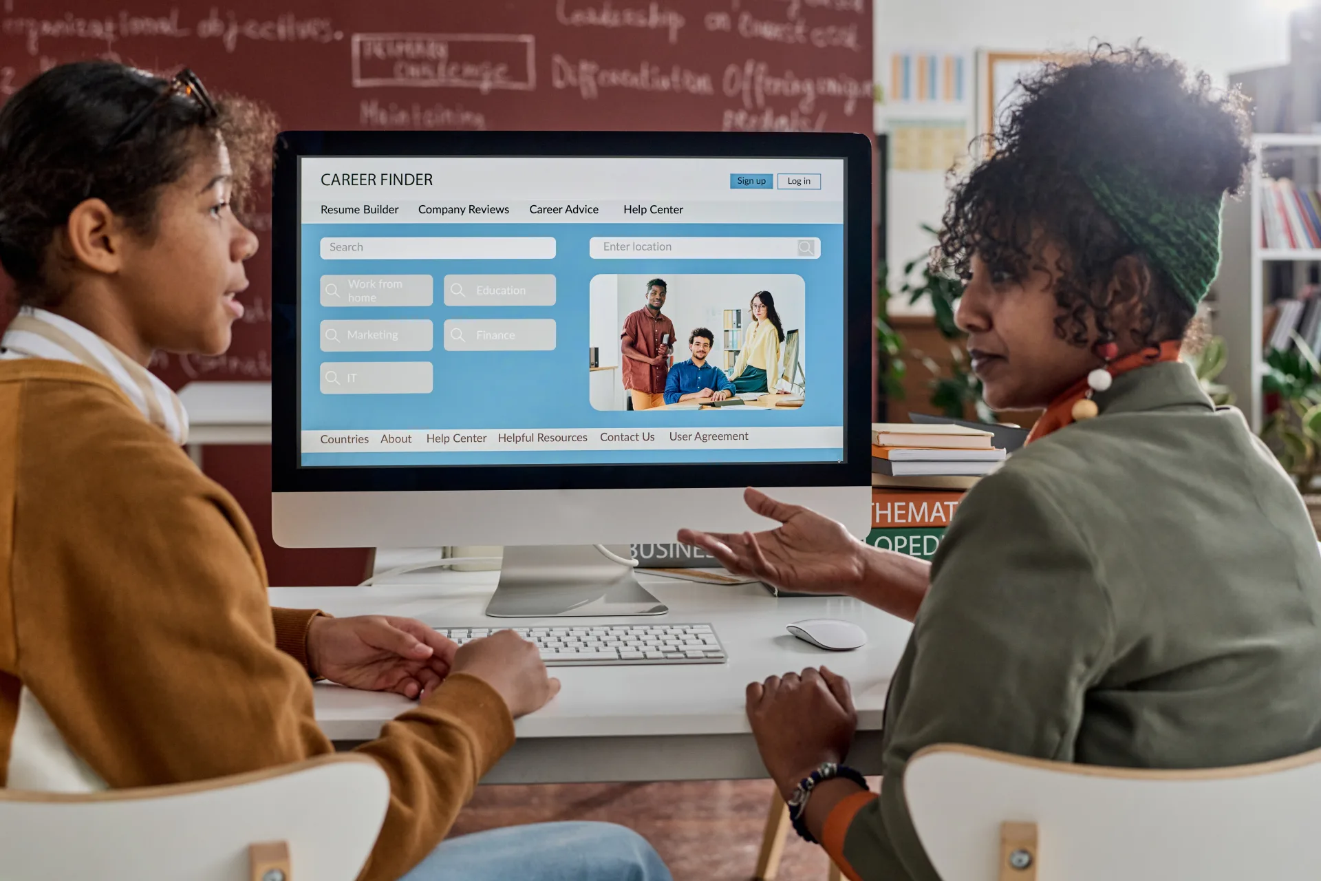 Two students explore career opportunities on a computer.